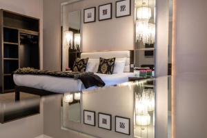 Voodi või voodid majutusasutuse Zuni Restaurant & Boutique Hotel toas