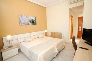 TV a/nebo společenská místnost v ubytování Hotel Complejo Los Rosales