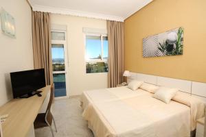 TV a/nebo společenská místnost v ubytování Hotel Complejo Los Rosales