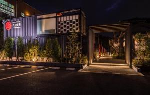 an external view of a building at night at HOTEL R9 Kujukuri "ex Casual Resort COFF Ichinomiya" in Ichinomiya