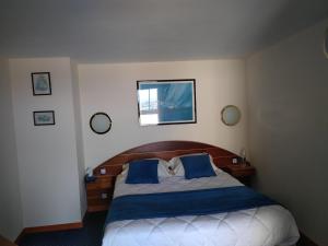 Postel nebo postele na pokoji v ubytování Hotel De La Mer