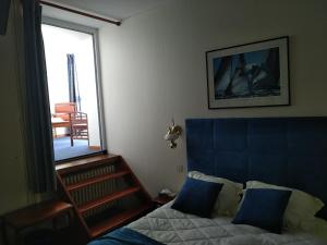 Postel nebo postele na pokoji v ubytování Hotel De La Mer