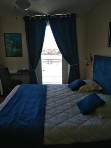 Postel nebo postele na pokoji v ubytování Hotel De La Mer