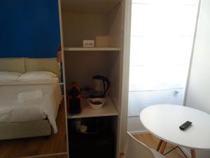 Postel nebo postele na pokoji v ubytování Blue Design Suite