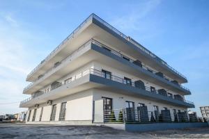 a building with balconies on the side of it at Complex Bavaro in Mamaia Sat/Năvodari