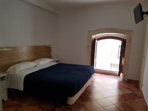 Postel nebo postele na pokoji v ubytování Iblea Paradise