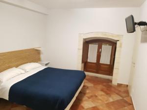 Postel nebo postele na pokoji v ubytování Iblea Paradise