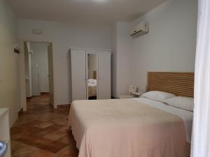 Postel nebo postele na pokoji v ubytování Iblea Paradise
