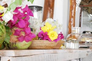 a table with flowers in a basket on it at Sea View Lodge Boutique Hotel in Jambiani +157 photos