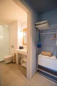 a bathroom with a toilet and a sink at Can Alemany in Santa Margarita de Mombúy
