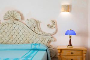 Кровать или кровати в номере Hotel Poseidonia