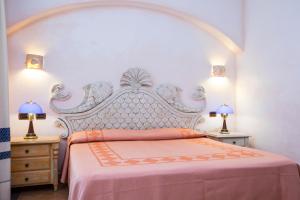 Кровать или кровати в номере Hotel Poseidonia