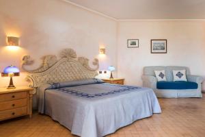 Кровать или кровати в номере Hotel Poseidonia