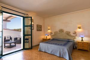 Кровать или кровати в номере Hotel Poseidonia