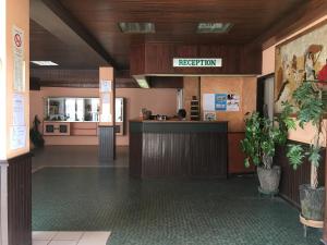 a lobby with a reception desk in a building at Motel d'Antananarivo in Antananarivo +45 photos