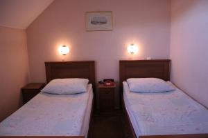 Postel nebo postele na pokoji v ubytování Guesthouse Janez