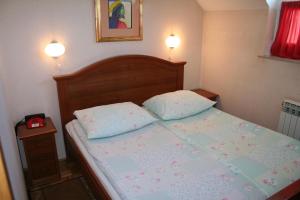 Postel nebo postele na pokoji v ubytování Guesthouse Janez