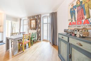 a dining room with a table and a toy train on it at Design Apartments - "Potsdam West", 80 in Potsdam
