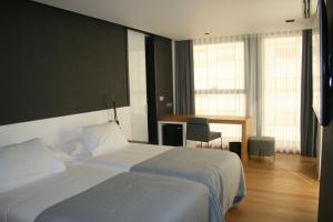 Postel nebo postele na pokoji v ubytování Hotel U Viveiro