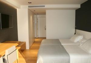 Postel nebo postele na pokoji v ubytování Hotel U Viveiro