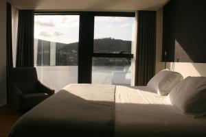 Postel nebo postele na pokoji v ubytování Hotel U Viveiro