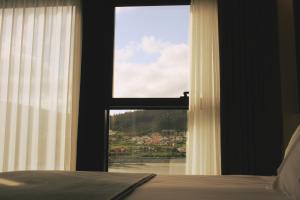 Postel nebo postele na pokoji v ubytování Hotel U Viveiro