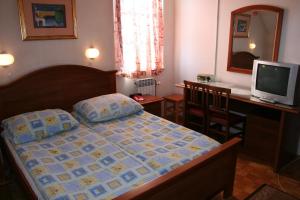 Postel nebo postele na pokoji v ubytování Guesthouse Janez