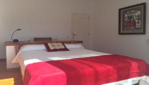 Ein Bett oder Betten in einem Zimmer der Unterkunft Villa Bella Portbou