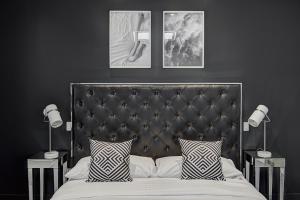 A bed or beds in a room at Les Lofts du Centre by Simplissimmo