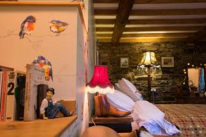 Postel nebo postele na pokoji v ubytování Low Mill Guesthouse