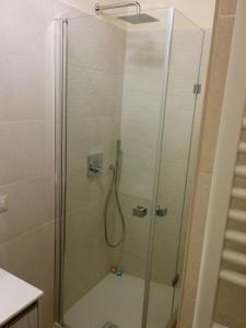 a shower with a glass door in a bathroom at Honey House Parma in Parma +63 photos