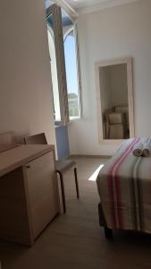 Cecio 5 Terre Rooms tesisinde bir odada yatak veya yataklar