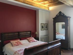 a bedroom with a bed and a large mirror at B&B L'Affresco in Mantova