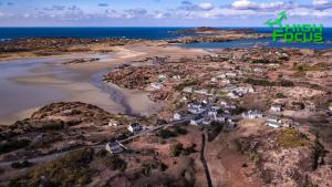 an aerial view of a small town on the coast at Teach Taigh in Kincasslagh