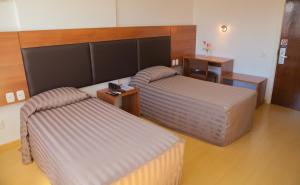 Postel nebo postele na pokoji v ubytování Itaimbé Palace Hotel