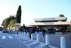 a group of people standing in front of a building at Andolfi 24 Rooms in Pompei