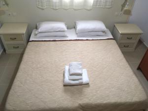 Ліжко або ліжка в номері Laskas Apartment