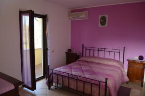 A bed or beds in a room at La Sorgente Del Subasio ASSISI
