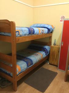 Cama ou camas em um quarto em Hostal Arenas del Mar