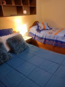 Cama ou camas em um quarto em Hostal Arenas del Mar