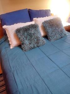 Cama ou camas em um quarto em Hostal Arenas del Mar