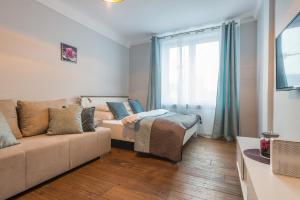 Łóżko lub łóżka w pokoju w obiekcie Dworzec Centralny P&O Serviced Apartments
