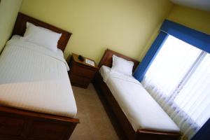 Cama o camas de una habitación en Hotel Grand Sumatera