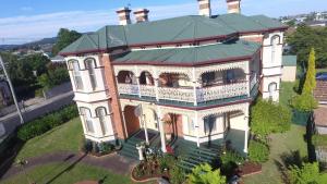 an aerial view of a large house with a balcony at The Grand On Macfie in Devonport