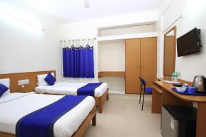 A bed or beds in a room at Arra Suites