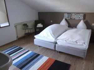 Llit o llits en una habitació de Haus Irmgard by Châtel Reizen