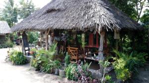 a small hut with a thatched roof at Eazy's Place in Dar es Salaam