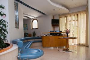 a waiting room with a blue slide in a hospital at Pansion Maestral in Novi Vinodolski