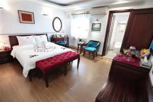 Krevet ili kreveti u jedinici u objektu Hanoi Siva Luxury Hotel & Travel