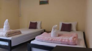 Postel nebo postele na pokoji v ubytování P.L.P Guesthouse - Mae Hong Son